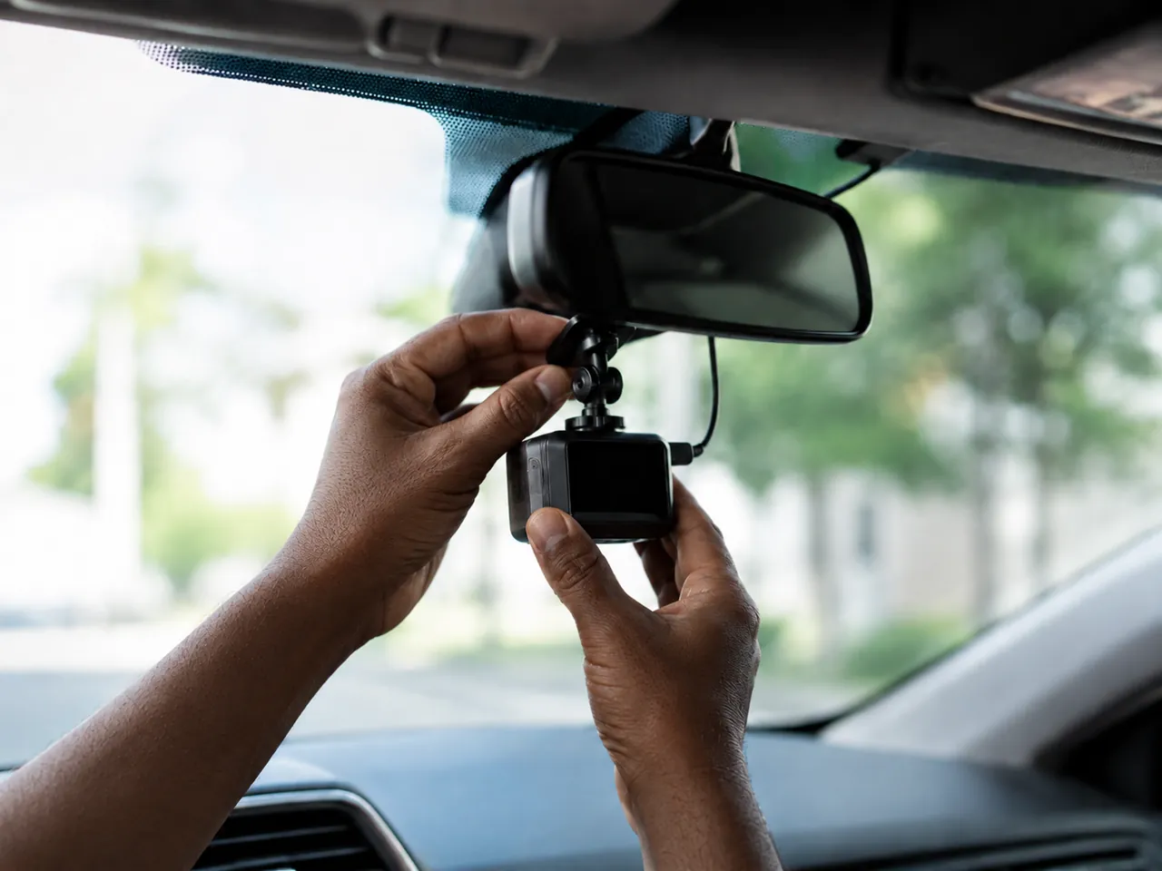 Dash camera mounted on a vehicle windshield