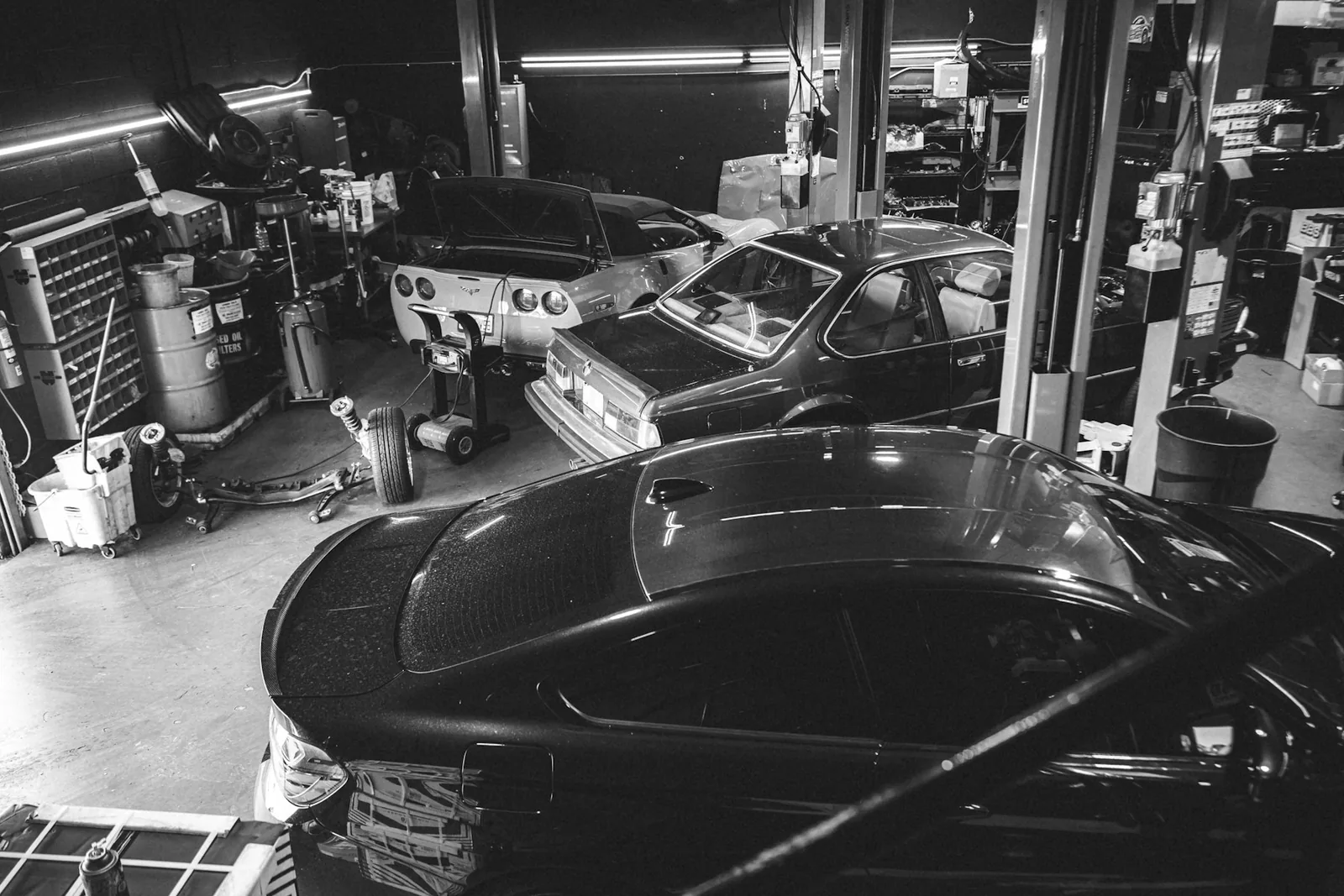 Vehicles inside an automotive shop